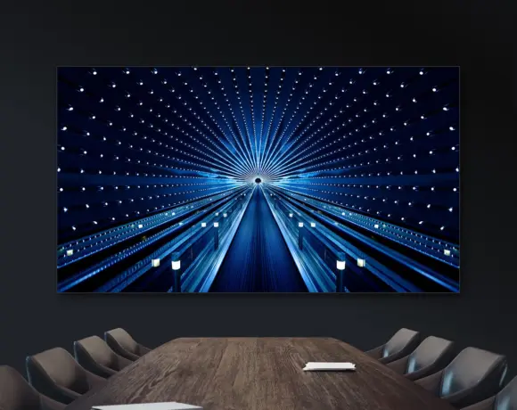 Groot, groter, grootst, tot het niet meer in de lift past: over schermen in vergaderruimtes